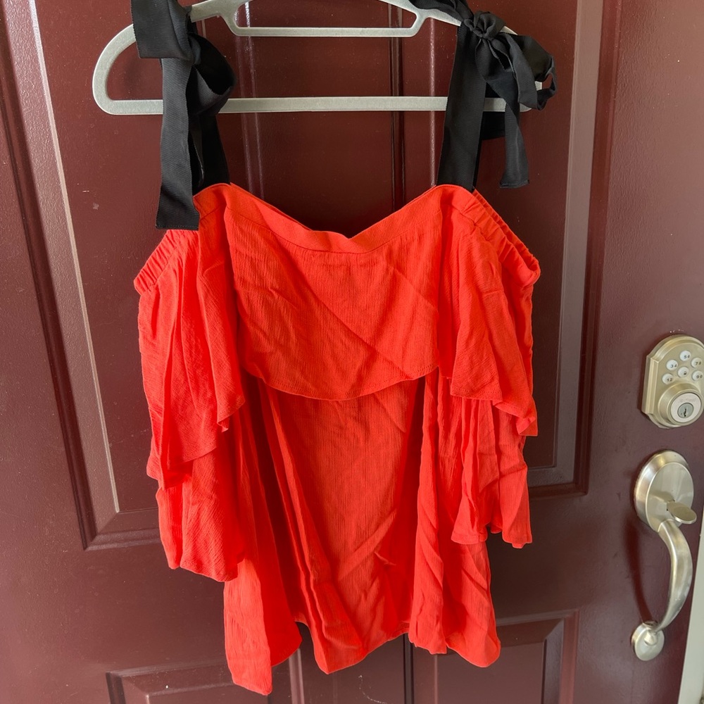 Loose Coral dressy top, large short sleeves and ties for straps.